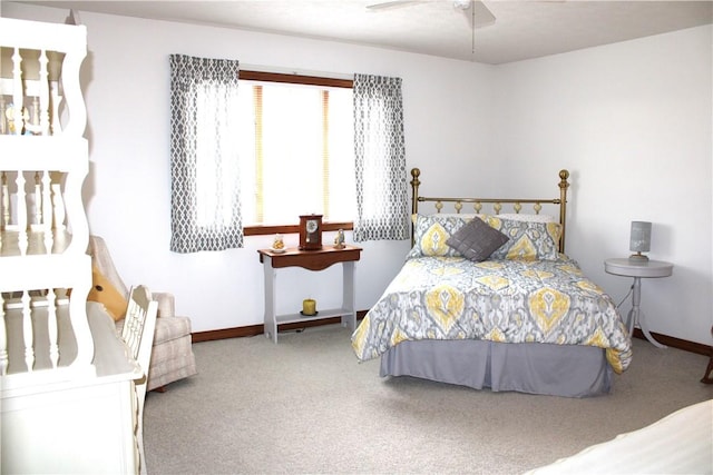 bedroom featuring baseboards, carpet floors, and a ceiling fan