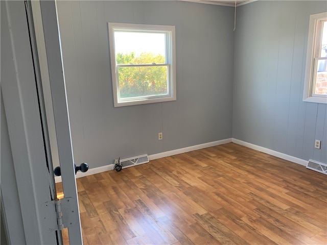 empty room with wood-type flooring