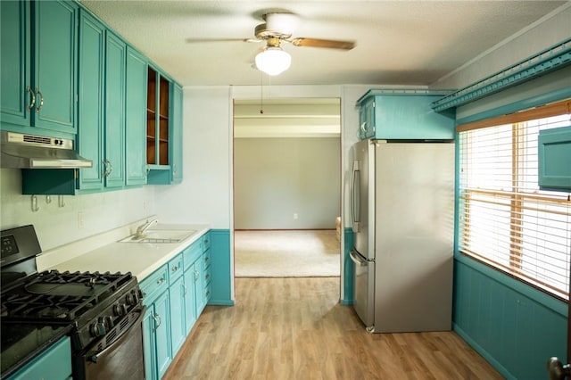 16 Franklin Rd, Bismarck, IL 61814 - kitchen with freestanding refrigerator, under cabinet range hood, black range with gas stovetop, a ceiling fan, and light wood-style floors