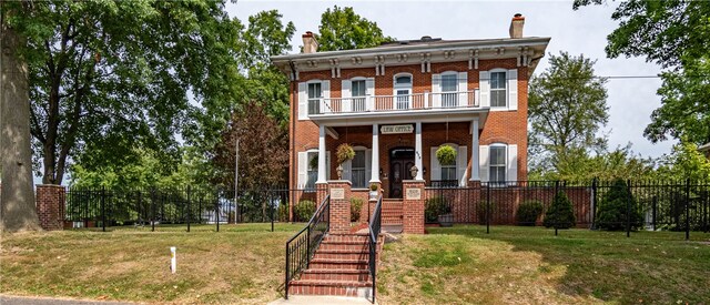 italianate house featuring a porch and a balcony