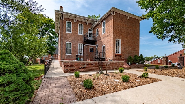 view of front of house with a balcony