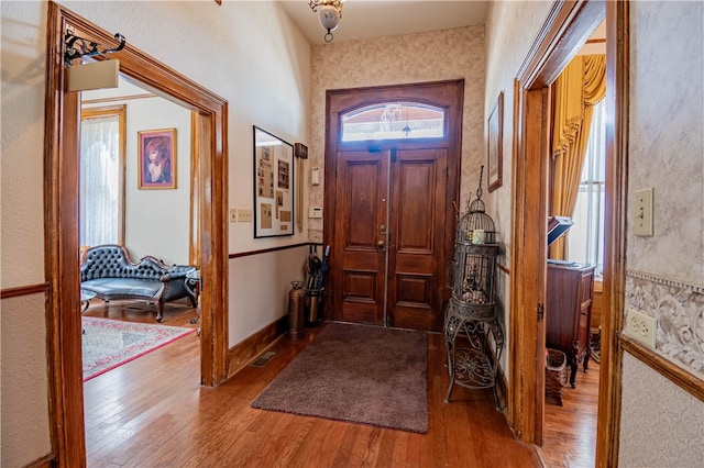 entryway with hardwood / wood-style flooring