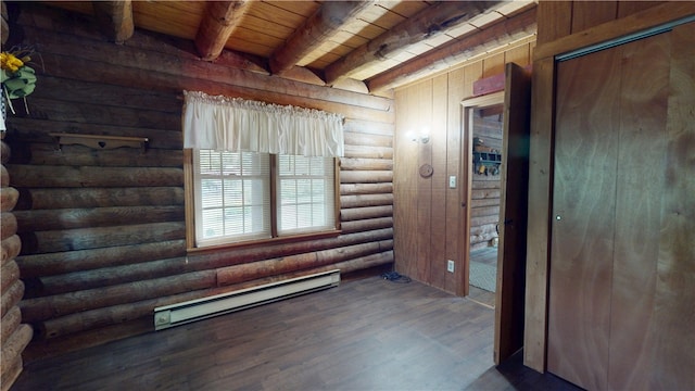 315 W Autumn Dr, Oakwood, IL 61858 - spare room featuring a baseboard radiator, log walls, a wooden ceiling with exposed beams, and wood finished floors