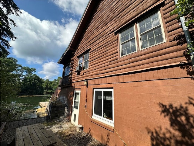 315 W Autumn Dr, Oakwood, IL 61858 - view of property exterior featuring log siding and a water view