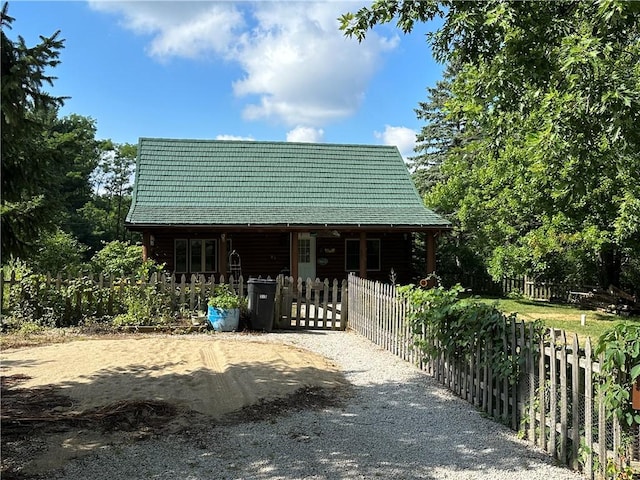 315 W Autumn Dr, Oakwood, IL 61858 - view of front of house featuring a fenced front yard, a porch, log siding, and a gate