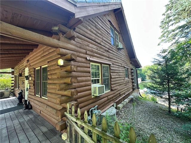 315 W Autumn Dr, Oakwood, IL 61858 - view of side of home with log exterior, cooling unit, and a deck