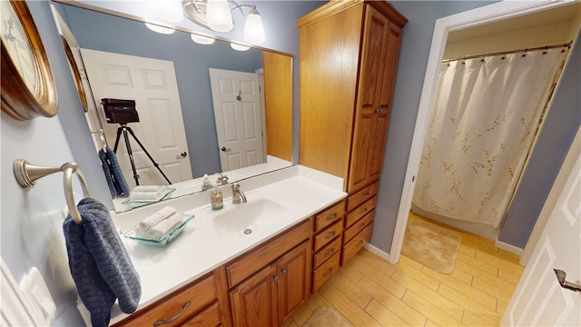 bathroom featuring vanity, curtained shower, and hardwood / wood-style floors