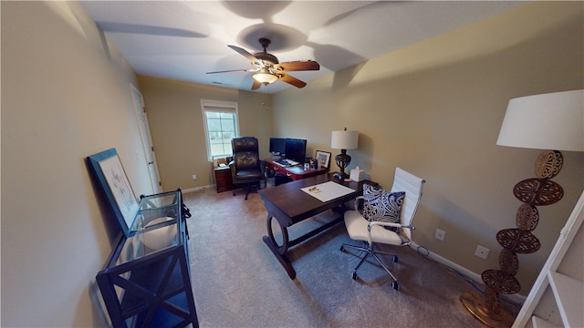 office space with ceiling fan and carpet