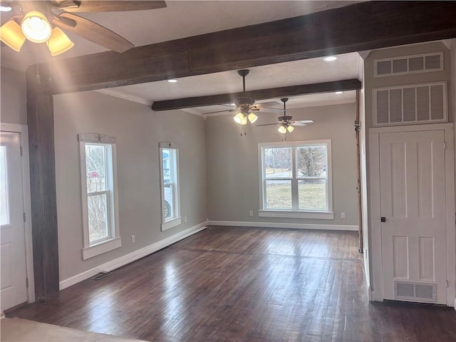 interior space featuring baseboards, visible vents, and dark wood finished floors