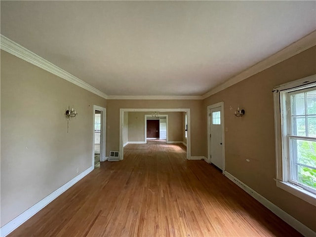 hall featuring wood-type flooring and ornamental molding