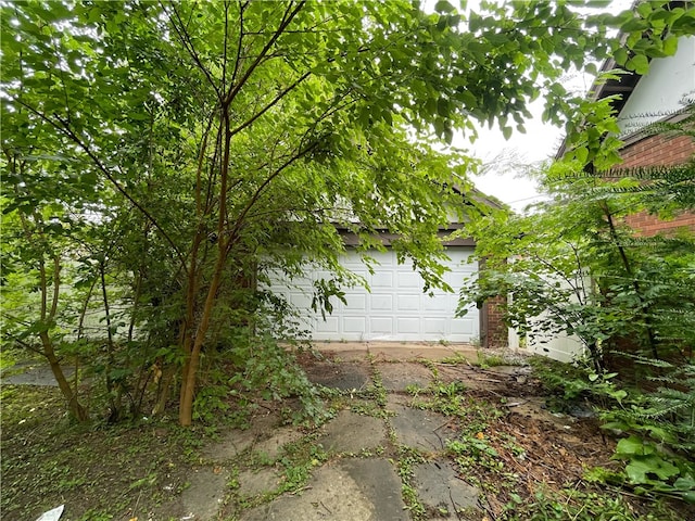 view of side of home with a garage