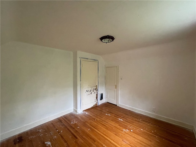 spare room with hardwood / wood-style floors