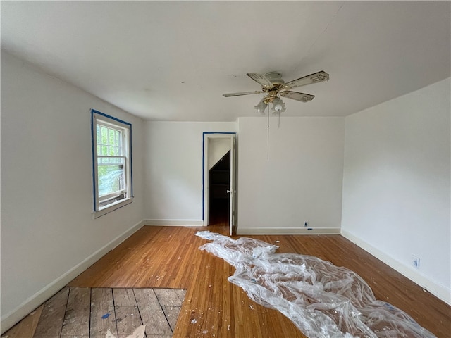 unfurnished room featuring wood-type flooring and ceiling fan