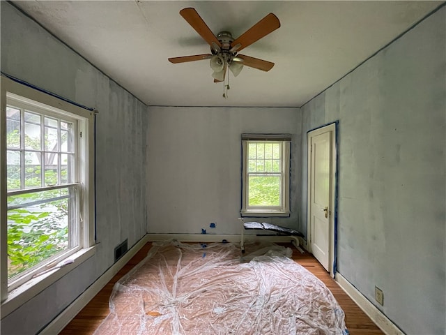 empty room featuring ceiling fan and light hardwood / wood-style floors