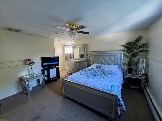 bedroom with ceiling fan and baseboard heating