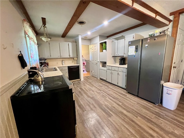 kitchen with black appliances, hanging light fixtures, light wood-type flooring, beam ceiling, and white cabinetry