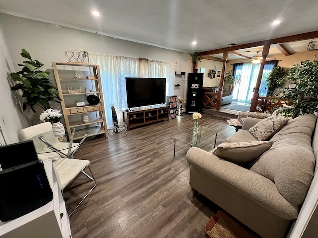 living room featuring beam ceiling, french doors, dark wood-type flooring, and ceiling fan