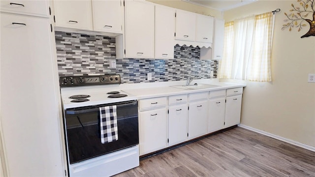 19 7th Dr, Decatur, IL 62521 - kitchen featuring white electric range oven, a sink, white cabinetry, backsplash, and light countertops