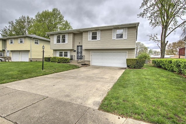 raised ranch with concrete driveway, a front yard, and a garage