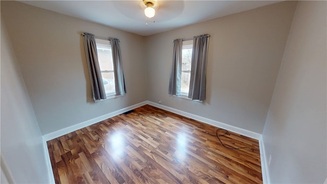 empty room featuring wood-type flooring and ceiling fan