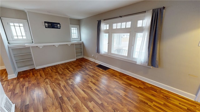 empty room with dark wood-type flooring