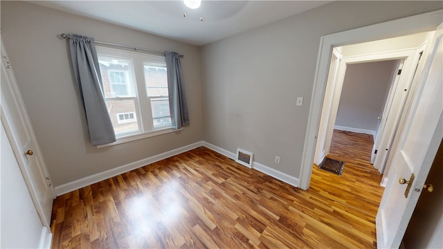 unfurnished room featuring ceiling fan and light hardwood / wood-style flooring