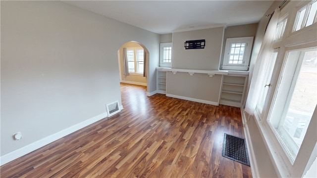 interior space with dark hardwood / wood-style floors