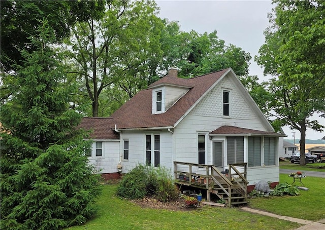 310 N Ellen St, Homer, IL 61849 - back of property with roof with shingles, a chimney, a deck, and a lawn