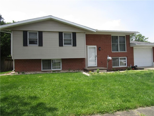 205 Franklin St, Pana, IL 62557 - raised ranch featuring an attached garage, a front lawn, and brick siding