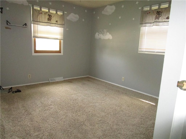 205 Franklin St, Pana, IL 62557 - carpeted spare room with baseboards