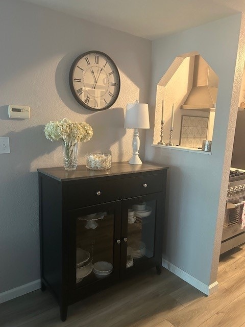 3221 E Lake Paradise Rd, Mattoon, IL 61938 - detailed view of wood finished floors and wall chimney range hood