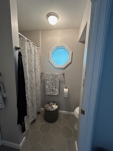 3221 E Lake Paradise Rd, Mattoon, IL 61938 - full bathroom featuring tile patterned flooring, a shower with shower curtain, and a textured ceiling