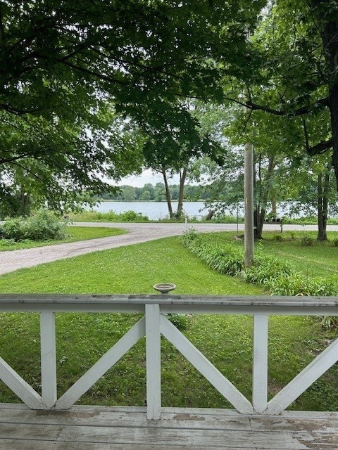 3221 E Lake Paradise Rd, Mattoon, IL 61938 - gate featuring a water view and a lawn