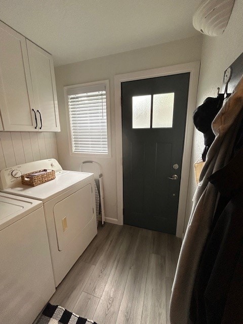 3221 E Lake Paradise Rd, Mattoon, IL 61938 - washroom with washer and dryer, cabinet space, and light wood-style floors