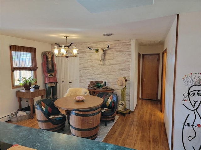 517 W Union St, Nokomis, IL 62075 - dining space featuring wood finished floors and a chandelier