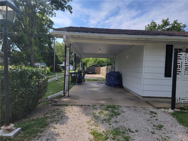517 W Union St, Nokomis, IL 62075 - view of parking / parking lot featuring an attached carport