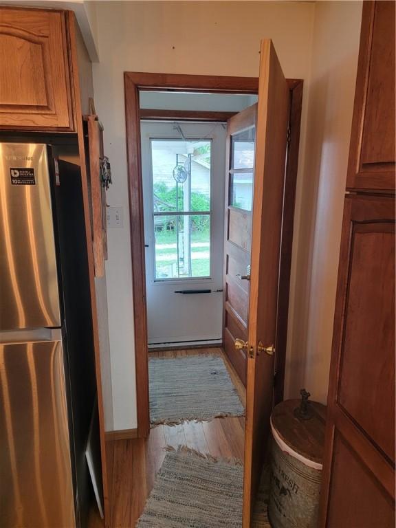 517 W Union St, Nokomis, IL 62075 - doorway with light wood-style flooring and baseboards