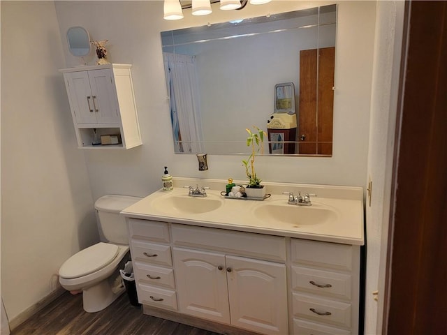 517 W Union St, Nokomis, IL 62075 - bathroom featuring double vanity and wood finished floors