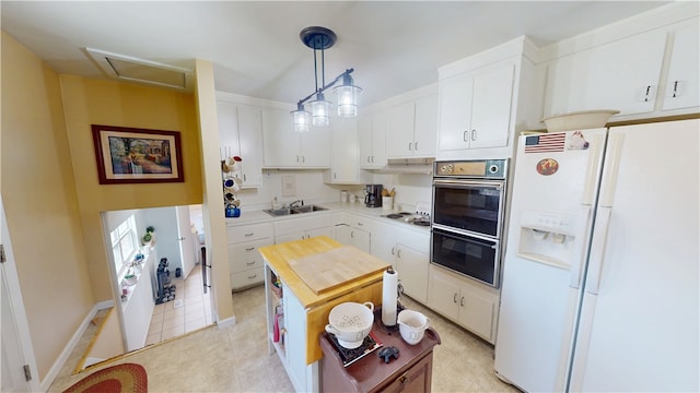 602 Maple Dr, Catlin, IL 61817 - kitchen featuring white refrigerator with ice dispenser, light countertops, and white cabinetry