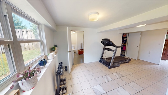602 Maple Dr, Catlin, IL 61817 - workout room with healthy amount of natural light and light tile patterned floors