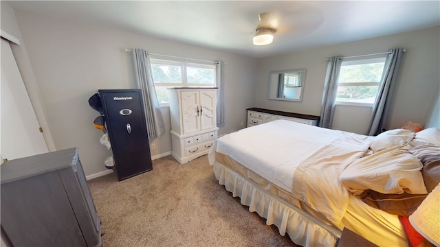 602 Maple Dr, Catlin, IL 61817 - bedroom featuring multiple windows, light colored carpet, and a ceiling fan