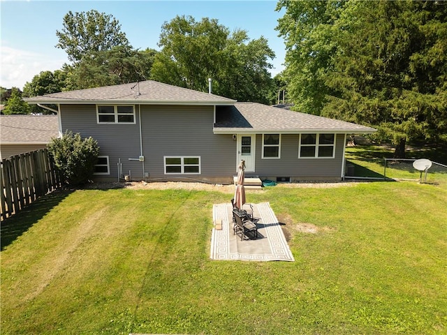 602 Maple Dr, Catlin, IL 61817 - rear view of house featuring a fenced backyard, a patio area, and a shingled roof
