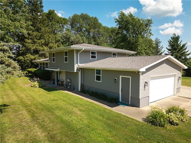 602 Maple Dr, Catlin, IL 61817 - view of front of house featuring driveway, a front lawn, a garage, and a shingled roof