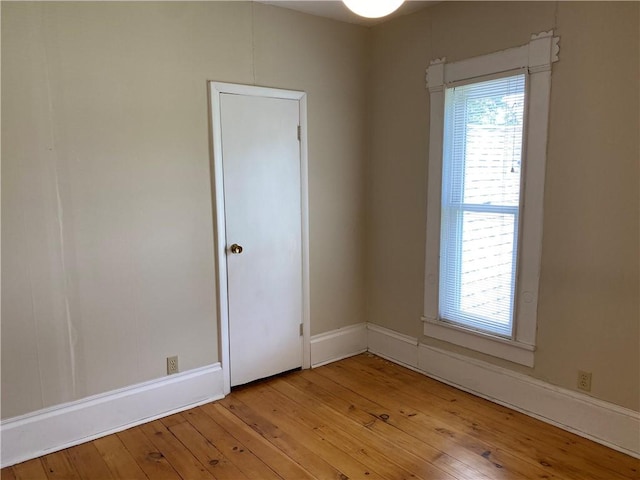902 1st St, Charleston, IL 61920 - empty room with light wood-type flooring