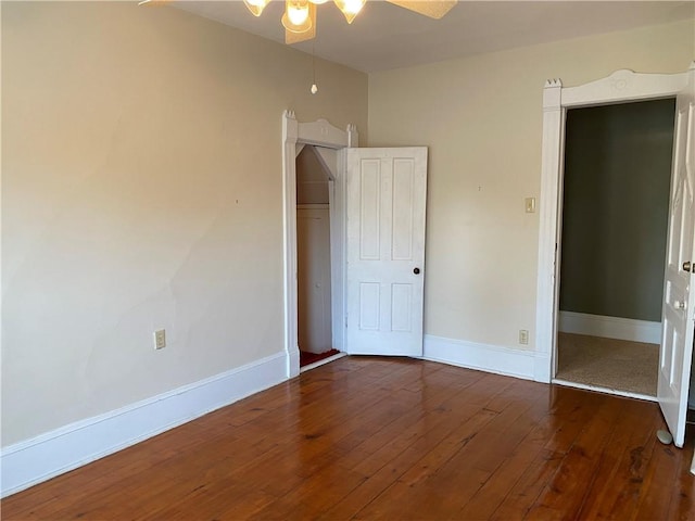 902 1st St, Charleston, IL 61920 - unfurnished bedroom featuring hardwood / wood-style flooring, baseboards, and a closet