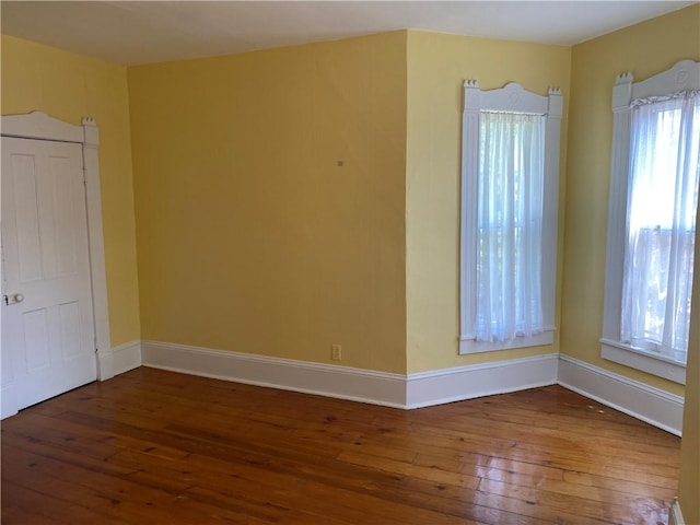 902 1st St, Charleston, IL 61920 - empty room with hardwood / wood-style flooring and baseboards