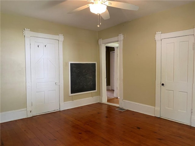 902 1st St, Charleston, IL 61920 - unfurnished bedroom with hardwood / wood-style floors, baseboards, and ceiling fan