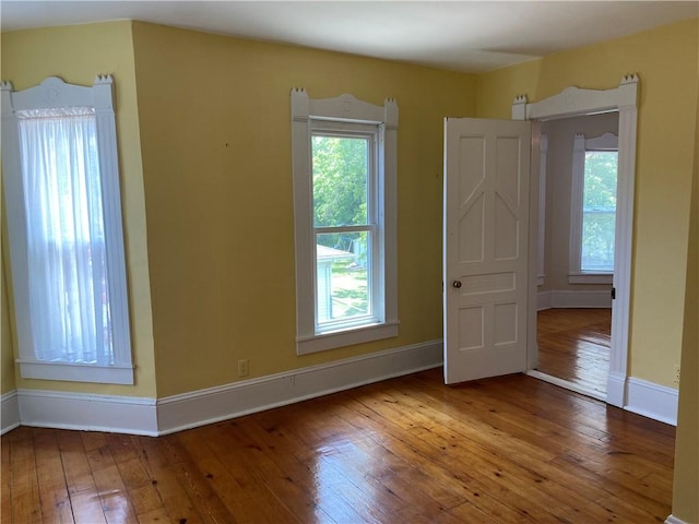 902 1st St, Charleston, IL 61920 - empty room featuring hardwood / wood-style floors and baseboards