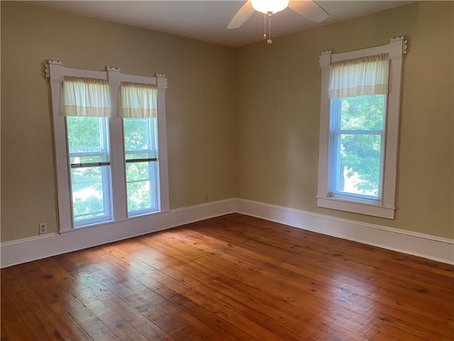 902 1st St, Charleston, IL 61920 - empty room featuring a ceiling fan, hardwood / wood-style flooring, and baseboards