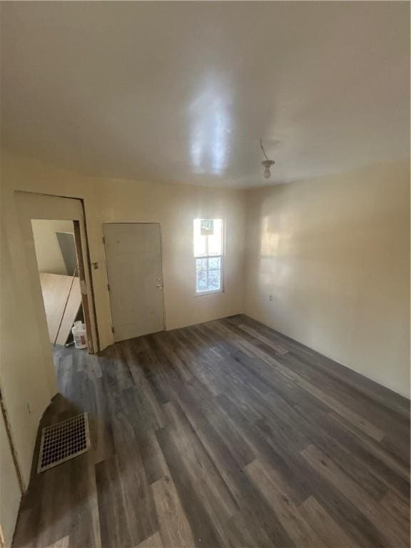 interior space featuring visible vents and dark wood-type flooring